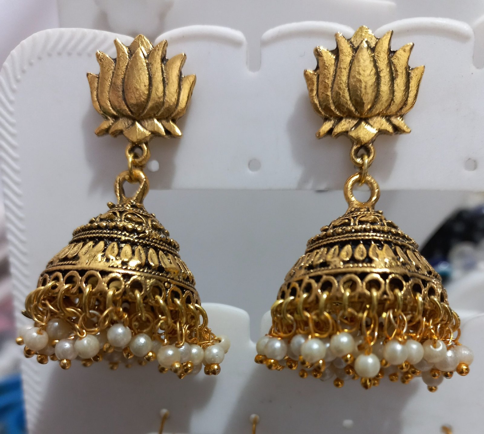 Golden jhumka with white loreals